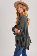 RUFFLED PEPLUM HEM OVERSIZED KNIT TOP