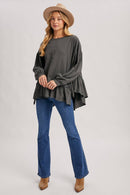 RUFFLED PEPLUM HEM OVERSIZED KNIT TOP
